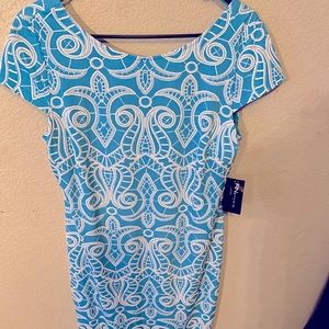 Turquoise pattern dress. Form fitted, below knee
